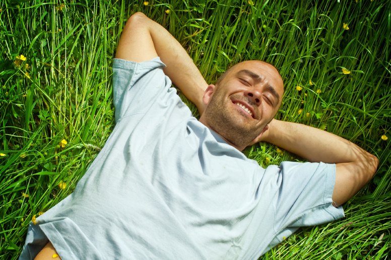 carefree-man-laying-in-grass-iStock-2x3